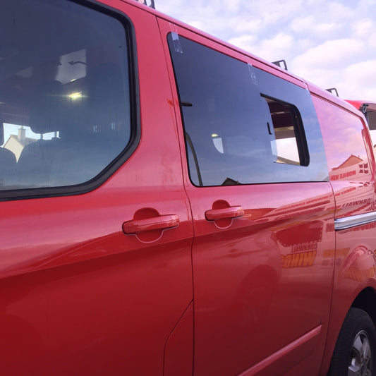 Transit custom sliding window in privacy glass