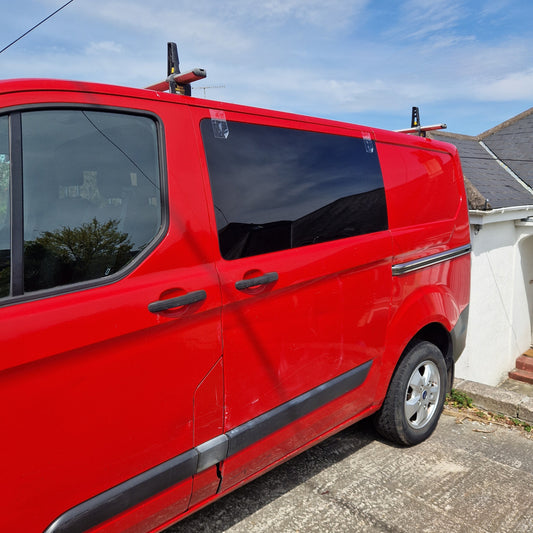 Red transit custom with a tinted window