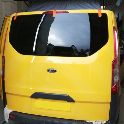 Yellow Transit Custom camper with tinted tailgate glass
